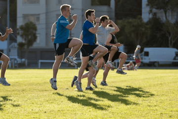 A group performing running form drills