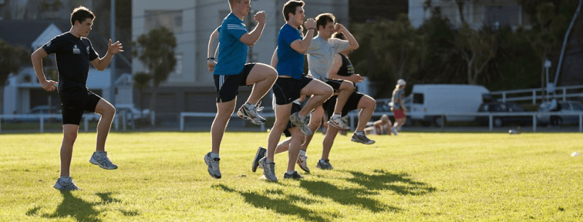 A group performing running form drills